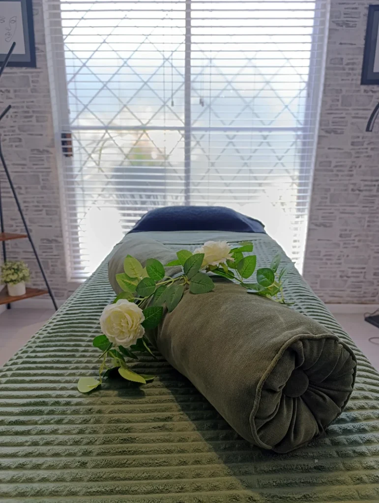 Close-up of luxury massage bed setup at Absolute Beauty, Brackenfell – offering professional facials and massage therapy.