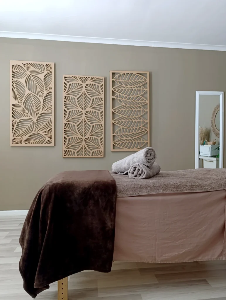 Warm and welcoming treatment room with artistic decor at Absolute Beauty in Brackenfell – ideal for therapeutic massage sessions.